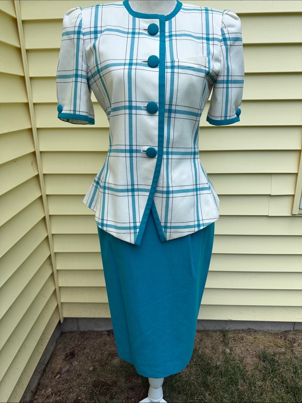 Turquoise and white Woman’s Suit